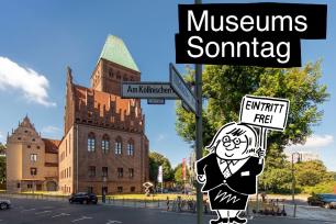 Märkisches Museum und Cartoon-Figur einer Frau mit Schild "Eintritt frei"
