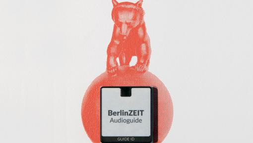 Audioguide-Symbol mit Berliner Bär auf Weltkugel